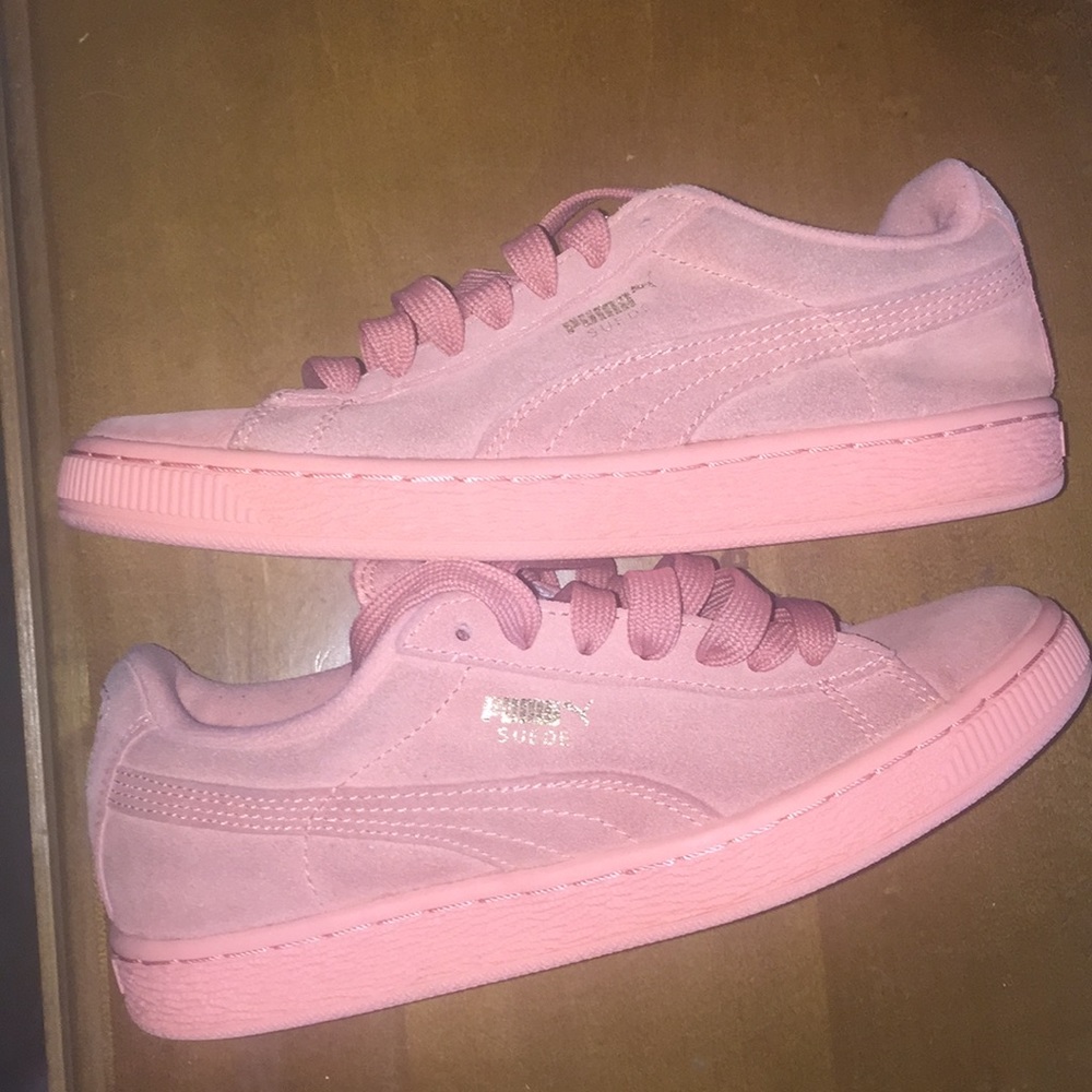 Pink suede pumas